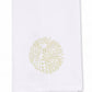 The Sea Urchin Bath Collection by Haute Home features a white linen cloth napkin adorned with a delicate circular light gold dotted pattern at its center, displayed on a plain background—an elegant accent designed to elevate refined home décor.