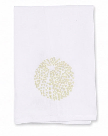 The Sea Urchin Bath Collection by Haute Home features a white linen cloth napkin adorned with a delicate circular light gold dotted pattern at its center, displayed on a plain background—an elegant accent designed to elevate refined home décor.