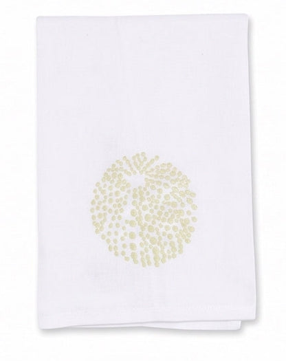 The Sea Urchin Bath Collection by Haute Home features a white linen cloth napkin adorned with a delicate circular light gold dotted pattern at its center, displayed on a plain background—an elegant accent designed to elevate refined home décor.