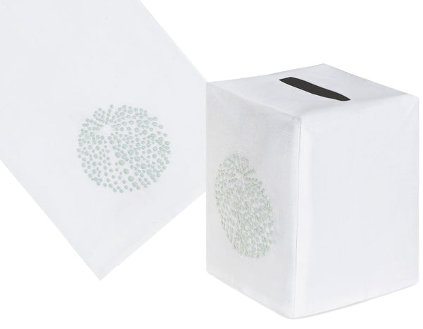 The Haute Home Sea Urchin Bath Collection in Aqua includes a white tissue box cover crafted from Italian linen, featuring an elegant hand-embroidered floral design with a cut-out on top, perfectly complementing matching tissues with the same delicate pattern.