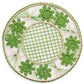 Handcrafted in Colombia, the Serenity Rattan Placemat Collection by Themis Z features round woven placemats with green flower shapes and a lattice center, showcasing a vibrant green and cream pattern.
