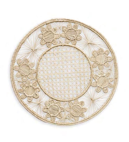 Themis Z’s Serenity Rattan Placemat Collection features round, handcrafted placemats with a woven lattice center and decorative floral edge, made from natural fibers.