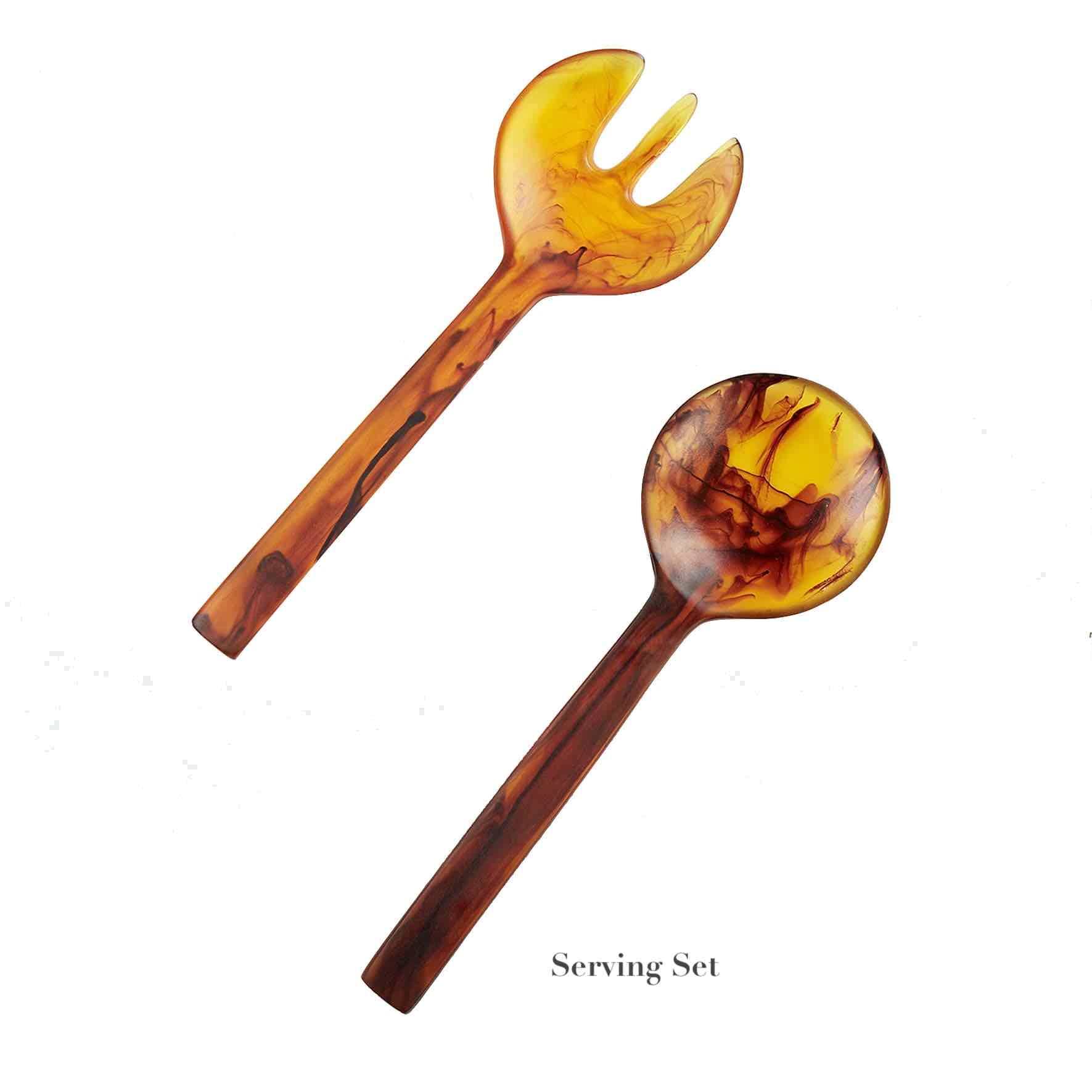 The Nashi Home Tortoise Resin Serveware Collection features a two-piece serving set with a marbled amber and brown finish. Shatter resistant, includes one spoon and one fork—perfect for elegant home decor. Displayed on white with "Serving Set" text.