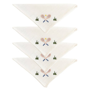 The Duggan Society Cocktail Napkin Collection features four white cotton napkins, each hand-embroidered with crossed tennis rackets, a ball, and green grass accents.