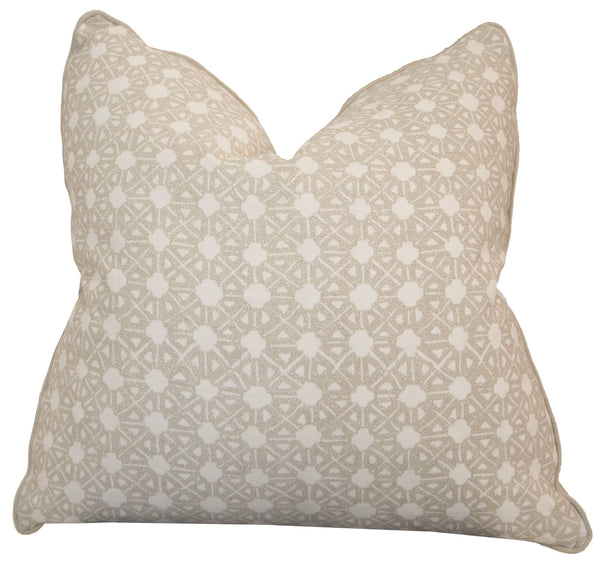 A Seville Shale Pillow by Associated Design with a geometric pattern in beige and white.