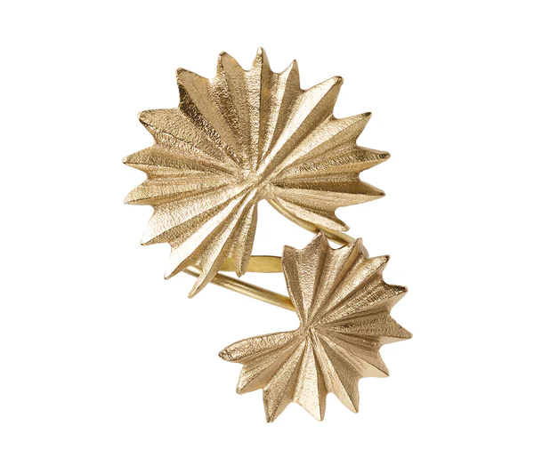 The Palmera Napkin Ring in Gold by Kim Seybert features two overlapping, textured fan shapes with pointed edges, offering a stylish accent inspired by brass napkin rings for modern or tropical table settings.