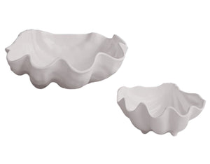 Two white bowls from the Beatriz Ball Vida Ocean Shell Bowl Collection, featuring wavy, clam shell-like edges, are shown against a plain background. Made of luxury melamine, they’re both elegant and dishwasher safe.