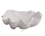 The Beatriz Ball Vida Ocean Shell Bowl Collection features large, white melamine bowls with wavy, scalloped edges—elegant, dishwasher safe pieces perfect for any setting.