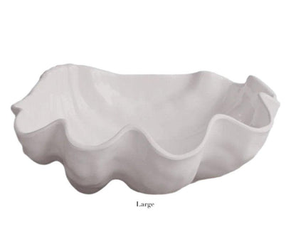 The Beatriz Ball Vida Ocean Shell Bowl Collection features large, white melamine bowls with wavy, scalloped edges—elegant, dishwasher safe pieces perfect for any setting.