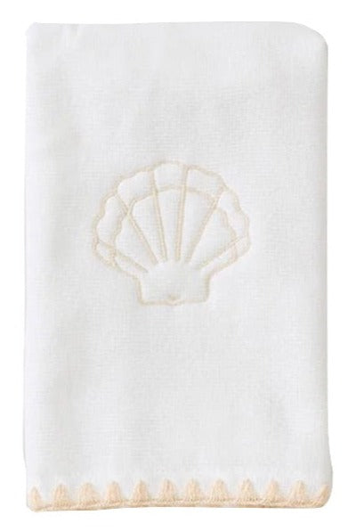 The Weezie Towels Sand Shell Stitched Guest Towel by Weezie Towels is a white hostess towel with palm and seashell embroidery, featuring absorbent terry fabric and a scalloped edge.