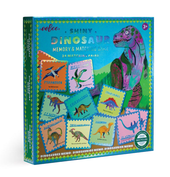 A colorful box of Eeboo's 'eeboo Shiny Dinosaur Memory and Matching Game' with illustrated dinosaurs on the cover.