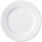 The Juliska Puro Whitewash Dinnerware Collection features a round, white ceramic plate photographed from above on a white background, offering a neutral palette ideal for serving teatime treats or savory tapas.
