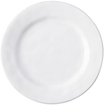 The Juliska Puro Whitewash Dinnerware Collection features a round, white ceramic plate photographed from above on a white background, offering a neutral palette ideal for serving teatime treats or savory tapas.