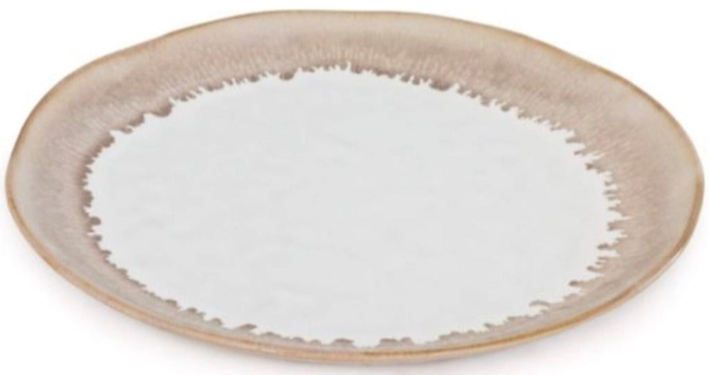 The Burlington Bluff Dinnerware Collection by Simon Pearce features a round ceramic plate with a beige rim, white center, and irregular edge design where the colors meet, inspired by pinch-pot styles.