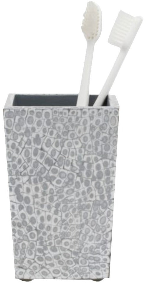 A gray mosaic toothbrush holder from the Callas Bath Collection by Pigeon & Poodle holds two white toothbrushes, bringing elegant style to your bathroom decor.