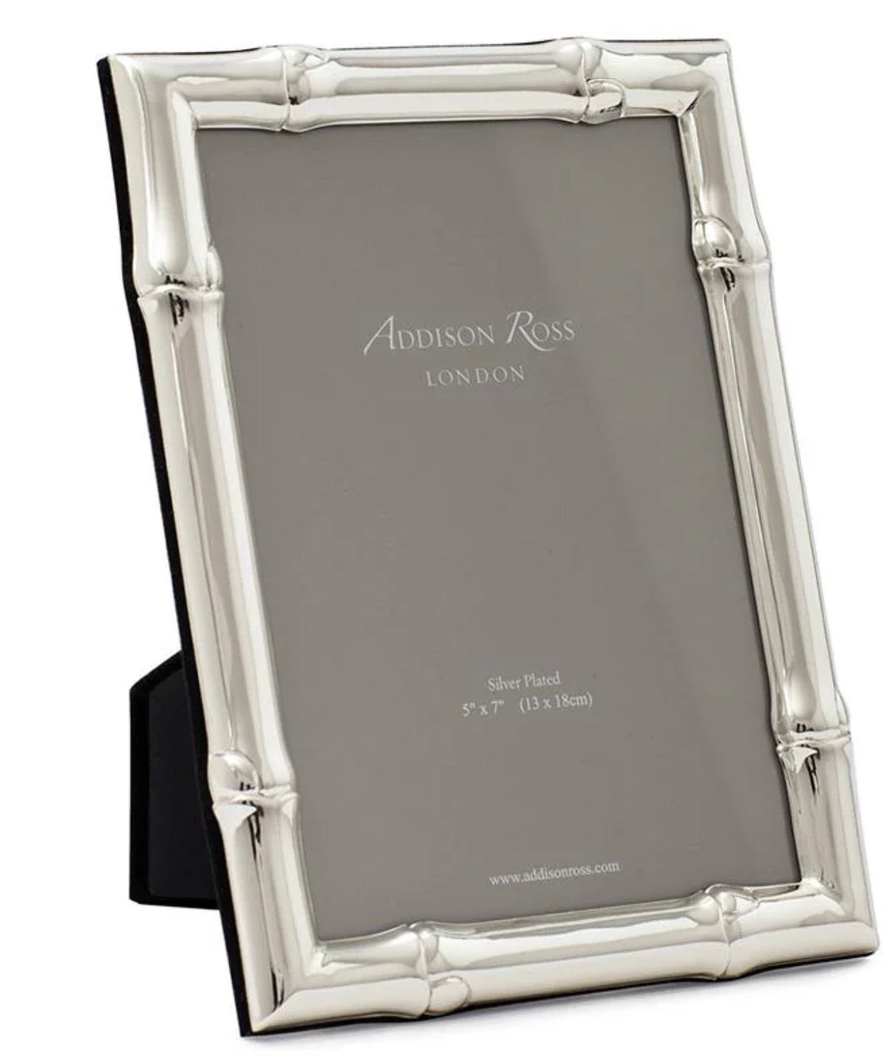 The Wide Bamboo Silver Plated Frame Collection by Addison Ross features a 5x7 inch frame in a bamboo design, finished in silver plate and standing upright with a black flexible easel support.