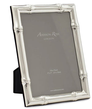 Presenting the Addison Ross Wide Bamboo Silver Plated Frame Collection, this picture frame with an elegant bamboo design holds a placeholder insert from Addison Ross, London. Featuring a flexible easel for versatile display, the frame measures 5" x 7" (13 x 18 cm).