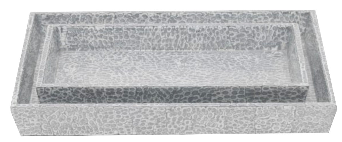 Two rectangular, silver-toned hammered metal trays from the Pigeon & Poodle Callas Bath Collection—one smaller and nested inside the other—evoke an elegant mosaic design against a white background.