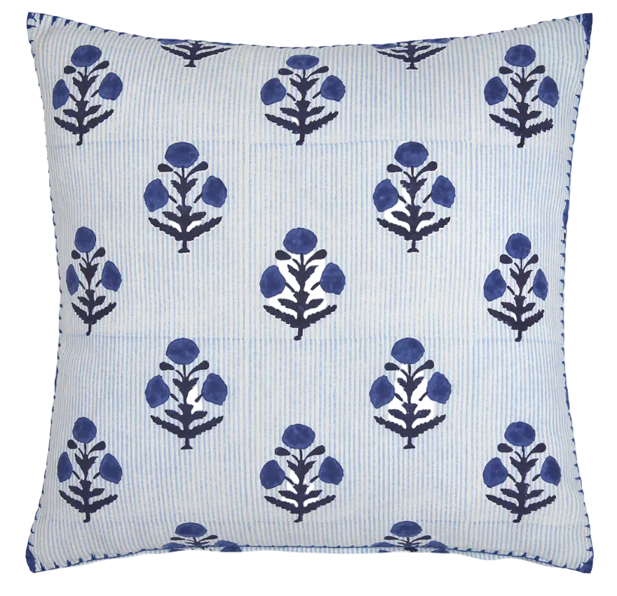 The Lucy Indigo Pillow by John Robshaw features a white background with light blue vertical stripes and dark blue floral motifs—an indigo accent that brings charm to any space.
