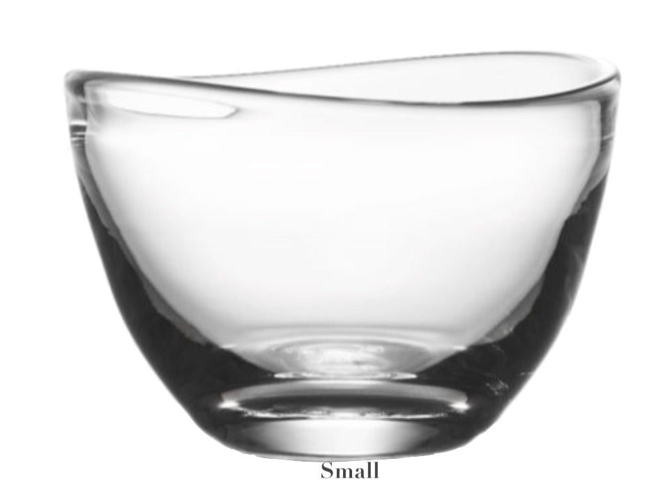 Explore the modern charm of the Simon Pearce Barre Bowl Collection. The graceful, asymmetrical design of this "Small" glass bowl fuses art with function, making it an eye-catching centerpiece and a practical addition to any contemporary décor.
