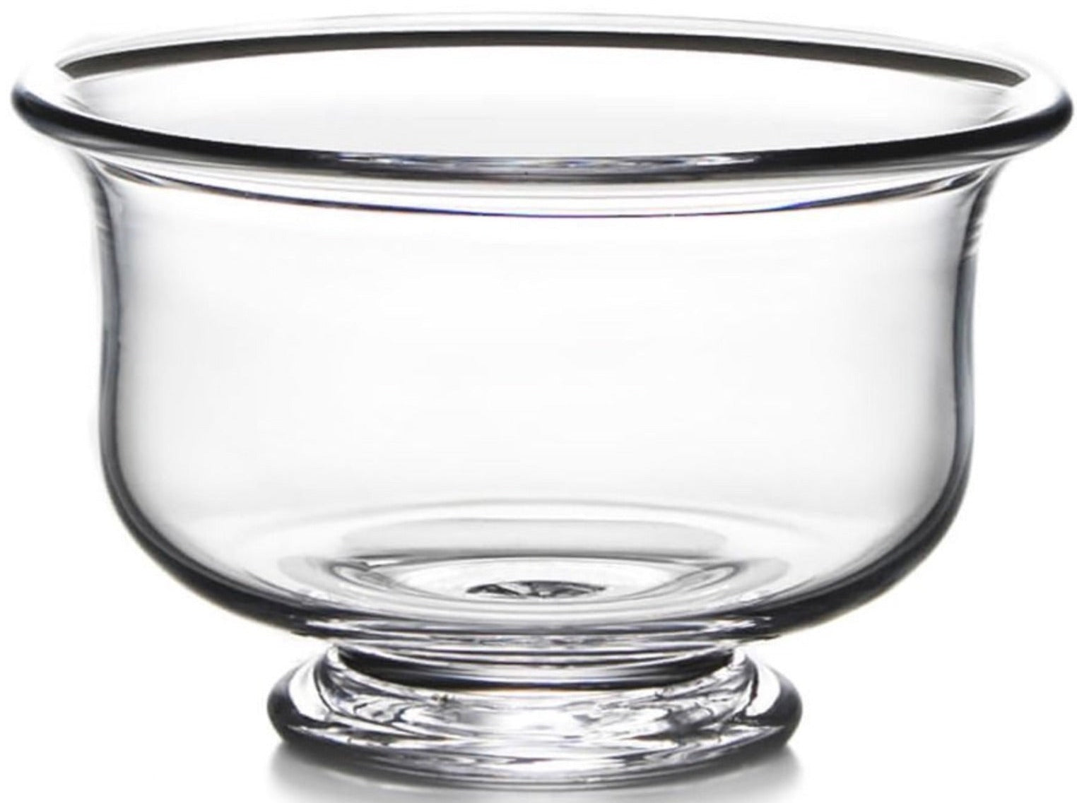 The Simon Pearce Revere Bowl Collection features clear glass bowls with wide openings and short pedestal bases, expertly handcrafted by artisans and shown against a white background.