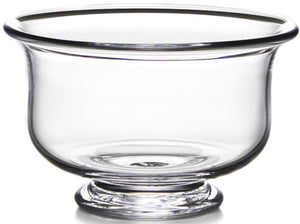 The Simon Pearce Revere Bowl Collection features clear glass bowls with wide openings and short pedestal bases, expertly handcrafted by artisans and shown against a white background.