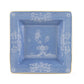 Square blue ceramic plate from the Oriente Italiano Pervinca Serveware & Decor Collection by Ginori 1735, featuring white floral patterns, a gold rim, and raised inner border, photographed on a white background.