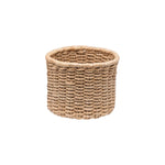 The Yuma Round Basket by Pigeon & Poodle features stylish, natural brown braided fibers for chic storage, displayed against a plain white background.