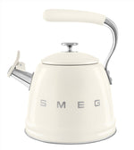 A white Smeg SMEG Whistling Kettle Collection stovetop kettle with a chrome spout and large capacity, featuring the brand name on the front and an ergonomic handle for comfortable pouring.