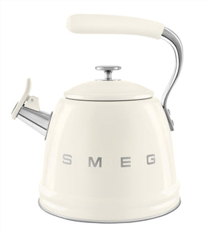 A white Smeg SMEG Whistling Kettle Collection stovetop kettle with a chrome spout and large capacity, featuring the brand name on the front and an ergonomic handle for comfortable pouring.