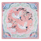 The Oh My Mahjong "Mahjong Mat Collection" features a square silk scarf with two white cranes amid blooming branches on a pink background, accented by pastel green, blue, and light red borders inspired by a Mahjong mat’s elegance.