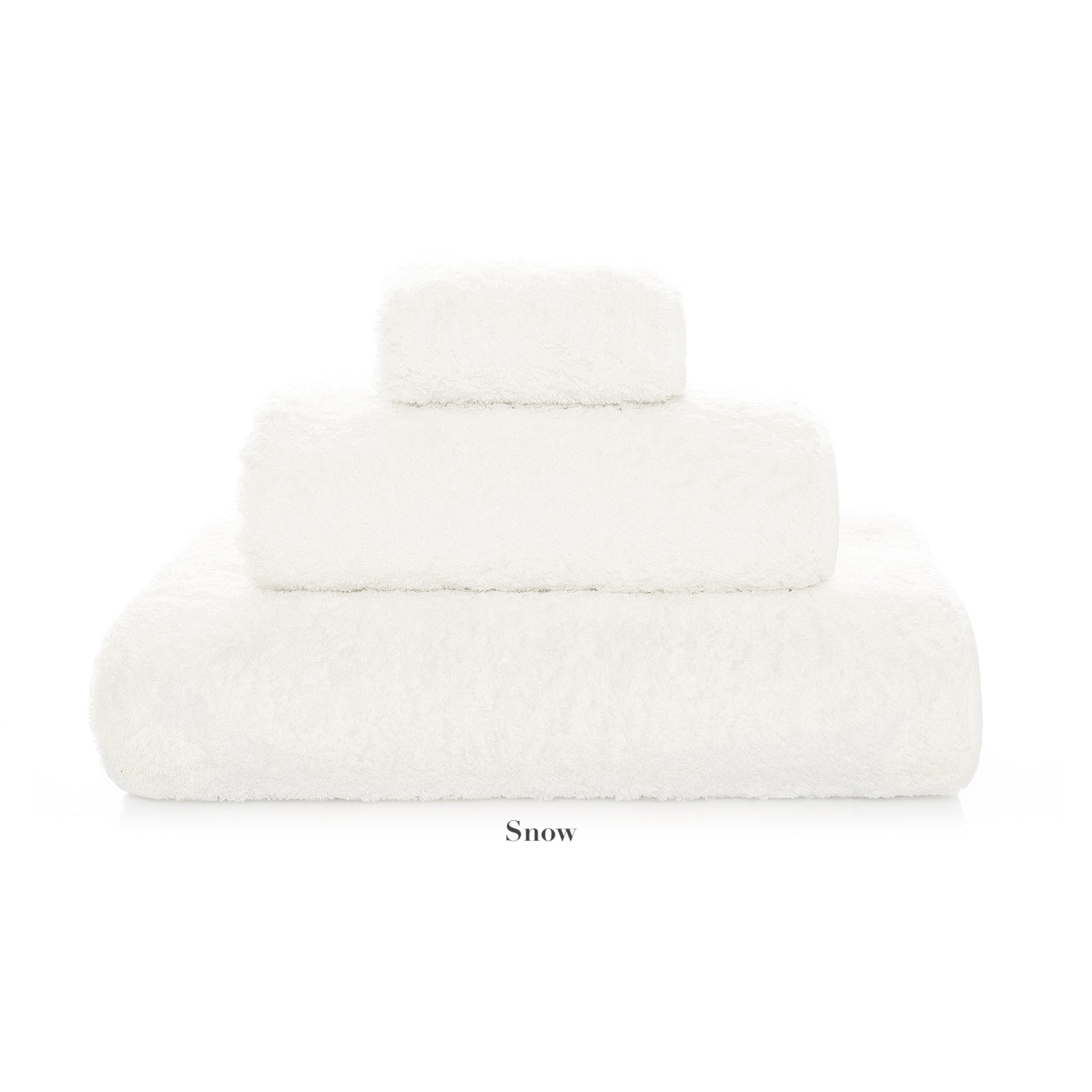 Three white "Egoist Bath Collection" towels by Graccioza, made from high density Egyptian cotton in various sizes, are stacked against a white background with the label “Snow” beneath them.