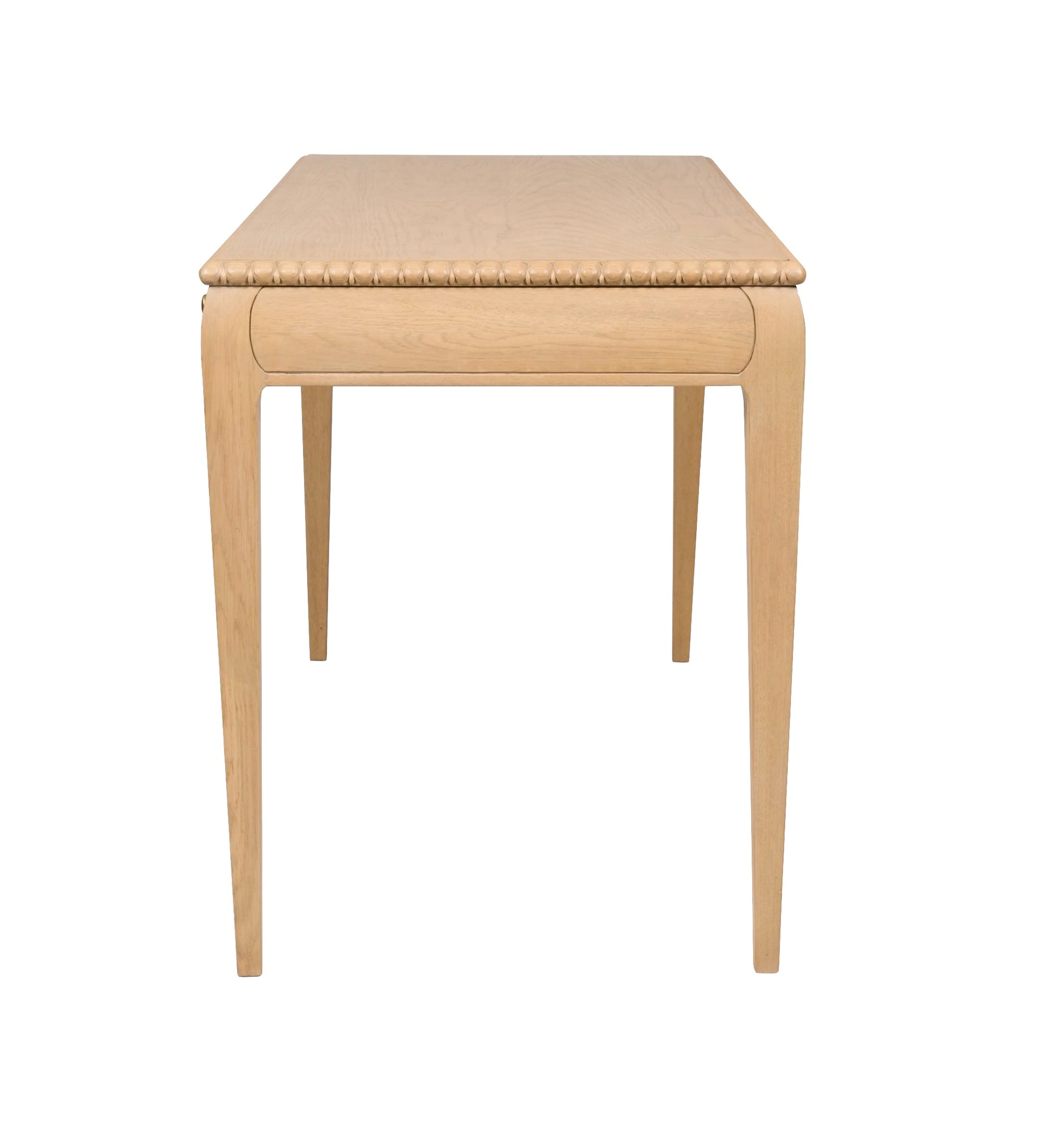 The Sofia Desk by Bunny Williams features a light oak finish, four tapered legs, and a smooth rectangular top, shown from the short end against a white background.