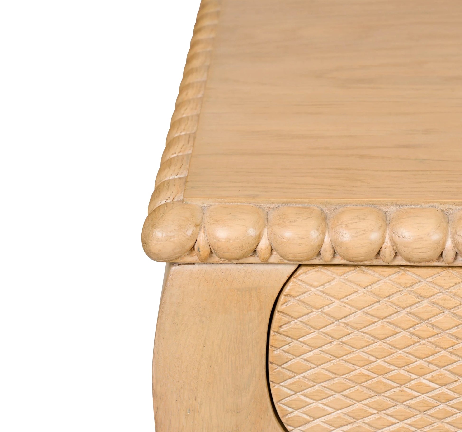 Close-up of the Sofia Desk by Bunny Williams in oak, showing a carved beaded edge and a drawer with a diamond-patterned front.