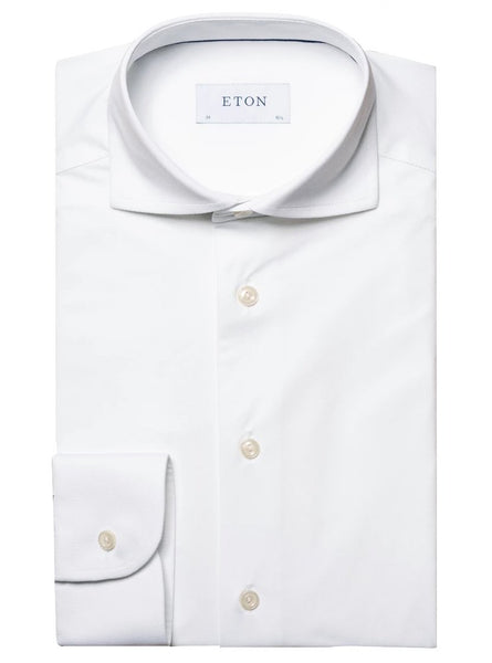A neatly folded Eton Four-Way Stretch Shirt, Contemporary Fit with a label reading "ETON" on the inside of the collar, crafted from luxurious tech fabric for exceptional comfort.