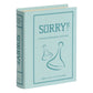 The WS Game Company’s Vintage Bookshelf Board Games features a light blue, fabric-wrapped book-shaped box labeled "SORRY!," with two pawn illustrations—perfect for fans of this classic game and the Vintage Bookshelf collection.