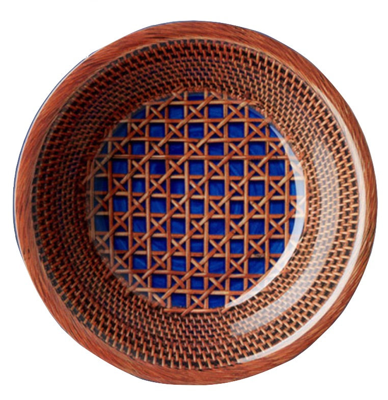 The Patagonia Blue Melamine Dinnerware Collection by Mario Luca Giusti features a round plate with a geometric lattice pattern in brown and blue, viewed from above against a white background—blending antique charm with modern style.