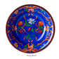 A blue soup bowl from the Mario Luca Giusti Pancale Blue Melamine Dinnerware Collection, featuring orange and red floral patterns, viewed from above.