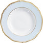A Raynaud Mazurka Or Fond Bleu Gris dinnerware plate in white porcelain, featuring a light blue rim, gold trim, scalloped edge, and a shallow central bowl.