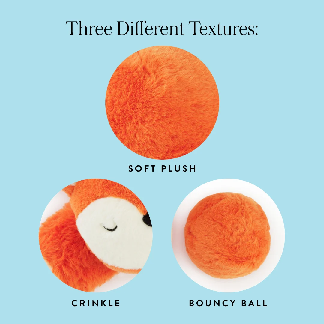 Three orange textures from The Foggy Dog’s Fox 2-in-1 Bounce Dog Toy are displayed on a light blue background: a soft plush, crinkle fabric shaped like an animal face—creating a playful fox—and a round, plush removable bouncy ball.