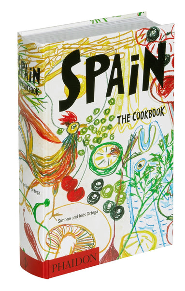 A colorful, best-selling cookbook titled "Phaidon Spain: The Cookbook" by Simone and Inés Ortega, featuring traditional Spanish recipes for home cooking.