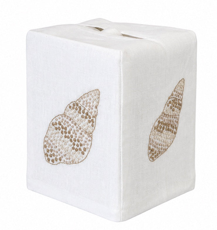 Elevate your linen home decor with the Haute Home Speckled Conch Coaster & Bath Collection: a white square tissue box cover, expertly crafted from premium Italian linen and adorned with embroidered beige seashell designs on two visible sides—an elegant accent set against a plain background.