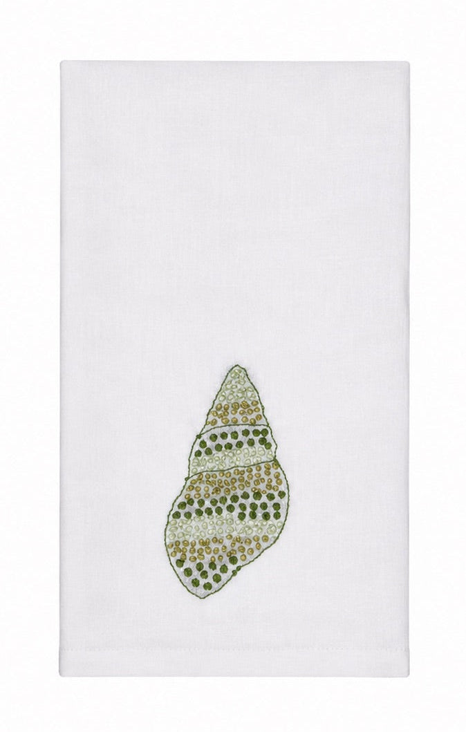 Elevate your linen home decor with the Haute Home Speckled Conch Coaster & Bath Collection. This white cloth napkin is beautifully crafted from luxurious Italian linen and showcases an embroidered green and gold seashell motif centered near the bottom, offering a sophisticated touch that pairs perfectly with matching linen coasters.