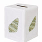 Bring a touch of elegance to your space with the Haute Home Speckled Conch Coaster & Bath Collection: this white tissue box cover features two green, embroidered leaf motifs on its visible sides and a top slot for tissue dispensing, blending classic Italian linen craftsmanship with refined linen home decor.