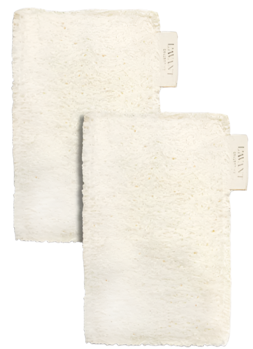 Pair these two off-white, textured washcloths—each with a "Lavant" tag—with L'Avant Collective Eco Friendly Sponges (Set of 2) for a plastic-free, sustainable cleaning routine.