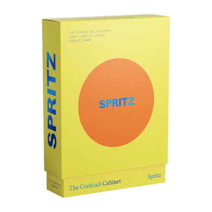 Box featuring a yellow and orange design with “SPRITZ” in blue on the side, labeled “The Cocktail Cabinet: Spritz” by Penguin Random House; includes the text “The essential cocktail recipes every spritz lover should know.”.