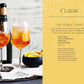 Two glasses of Spritz Cocktails by Simon & Schuster with ice and orange slices sit on a table, accompanied by Aperol, prosecco sparkling wine, and a metal jigger—the perfect ingredients for crafting classic Italian amaro spritz beverages.