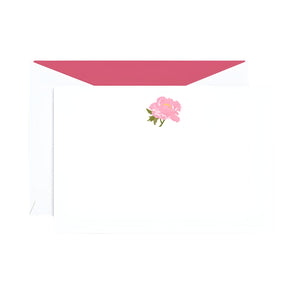 The Crane Peony Flat Note Card Set by Crane features white notecards with a pink peony illustration at the top and matching envelopes with pink lining—an elegant choice for any occasion.