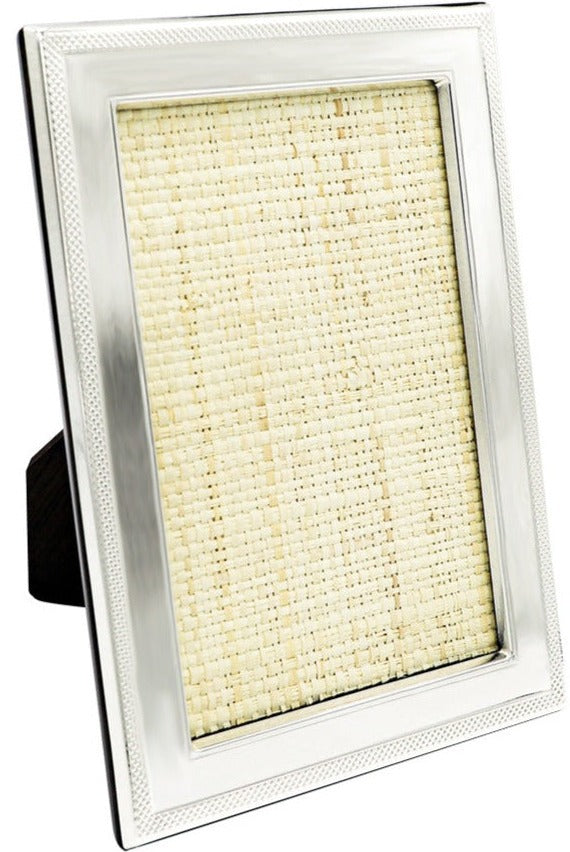 The Sterling Frame with Border Collection by Tizo Design features a rectangular 925 sterling silver frame with a mesh border, textured beige insert, and stands upright on a black easel back.