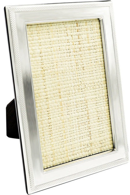 The Sterling Frame with Border Collection by Tizo Design features a rectangular 925 sterling silver frame with a mesh border, textured beige insert, and stands upright on a black easel back.